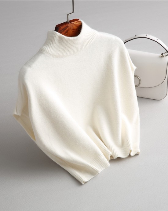 Wearing a low necked small stature with a high necked knitted pullover